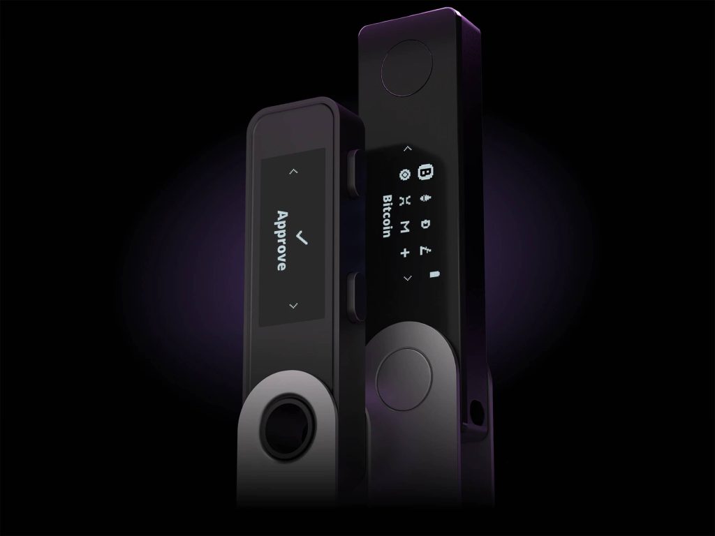 Ledger Nano S Plus – A Secure Non-Custodial Wallet for Dogecoin in 2025 A Ledger Nano S Plus hardware wallet placed on a wooden surface, with its screen displaying a cryptocurrency-related interface. The compact and sleek design of the wallet is emphasized, making it a secure option for storing Dogecoin and other digital assets.